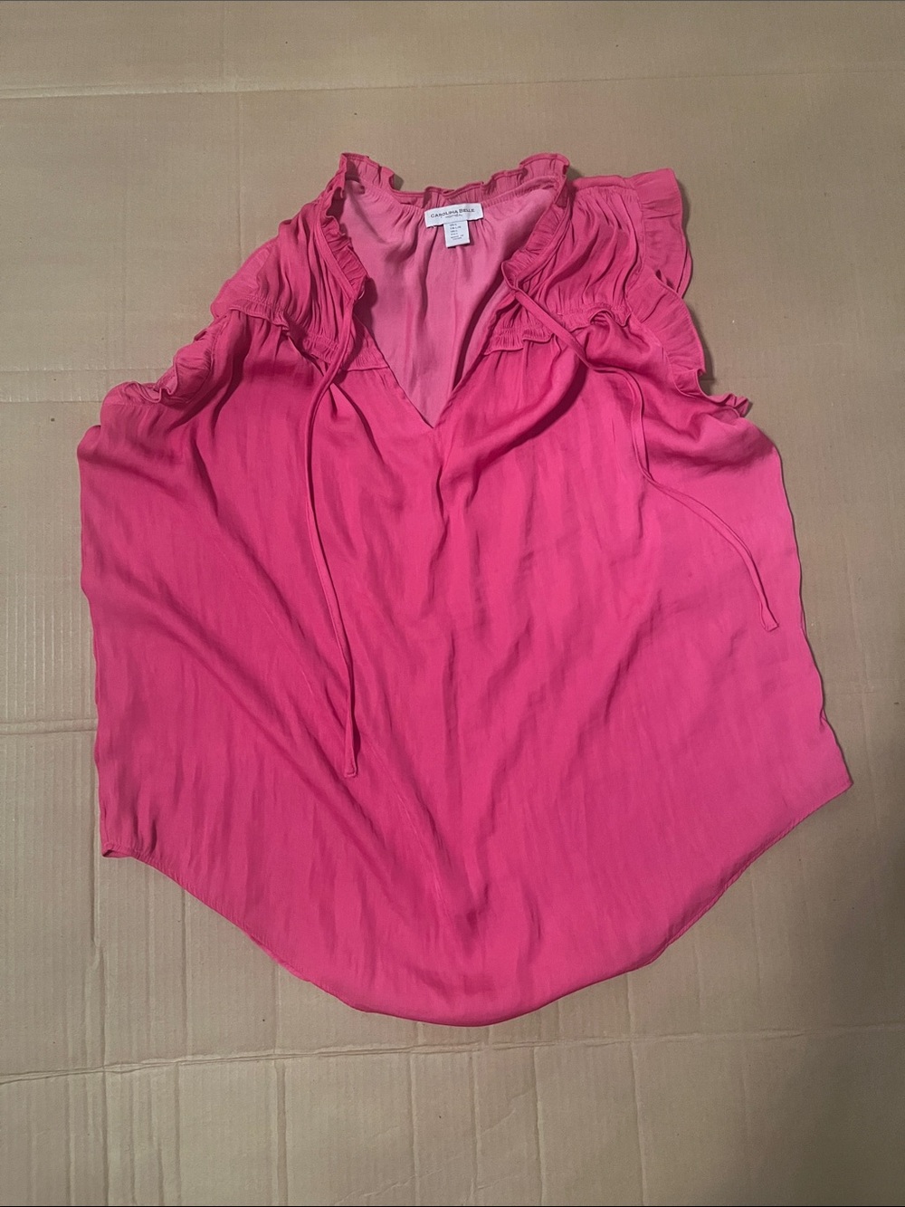 sleeveless pink blouse